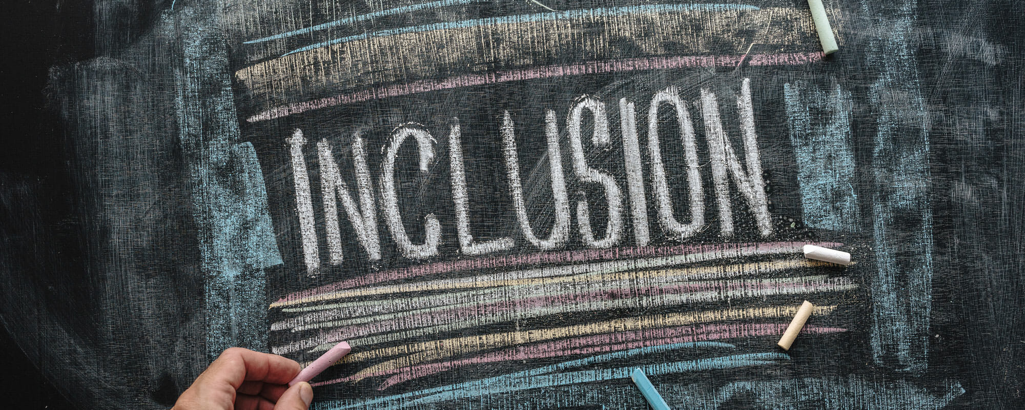Inclusion written on chalkboard